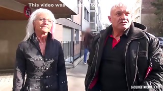 Mature woman with silver hair is wearing erotic lingerie while having sex with two guys