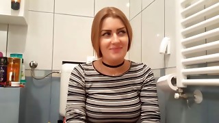 Horny girlfriend getting fucked from behind in a bathroom